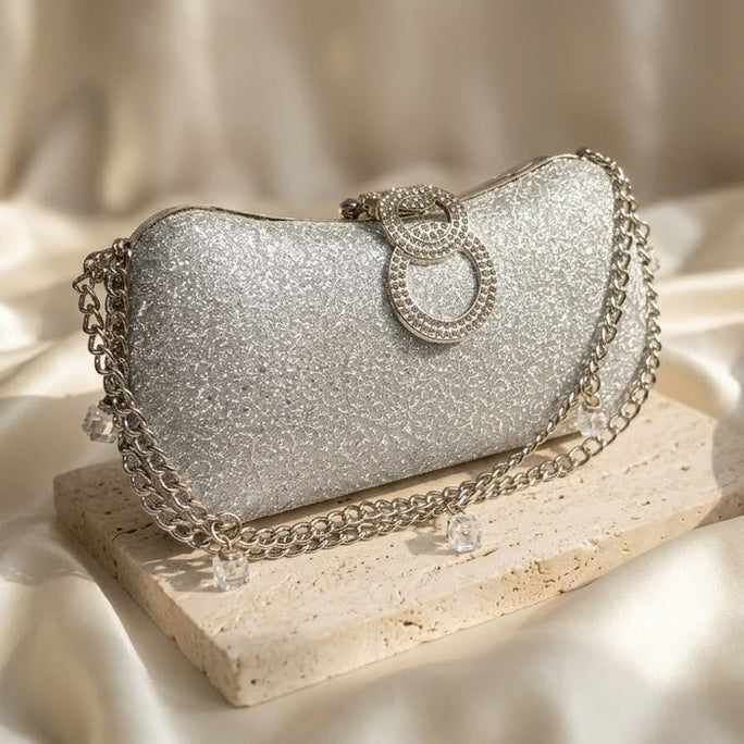Milli Legacy Shimmering Evening Clutch With Interlocking Crystal Rings